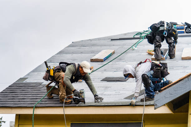 Professional Roofing technician working in New London, NH